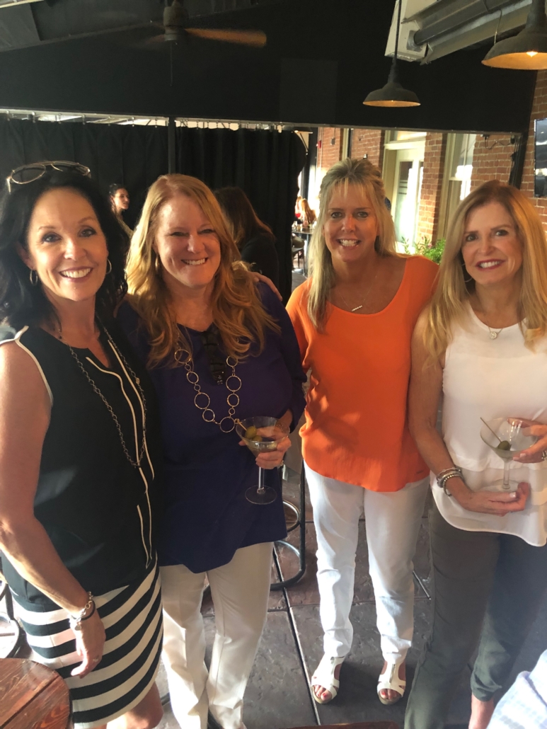 a group of female court reporters posing at happy hour
